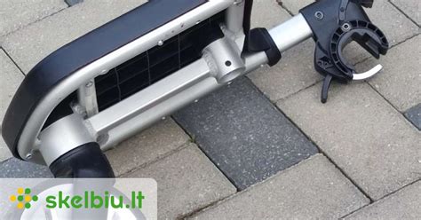 Pritvirtinimo mechanizmai prie vežimėlio