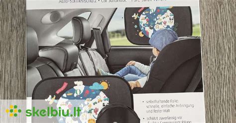 kūdikis automobiliyje su apsauga nuo saulės