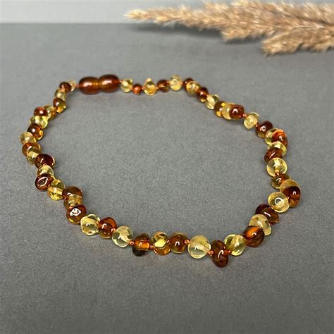 vaikiški papuošalai su brangakmeniais