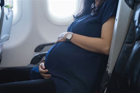 Pregnant woman flying on a plane