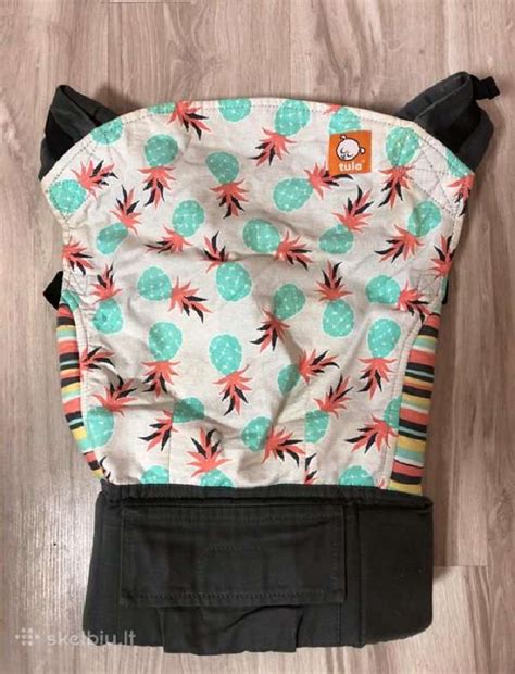 Ergonomiška kūdikio nešynės padėtis