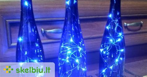 Kūrybiška foto zona su rėmeliais ir girliandomis