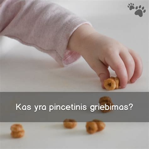 Kūdikis tobulina pincetinį griebimą smulkiais daiktais
