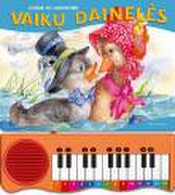 Vaikas groja žaisliniu pianinu