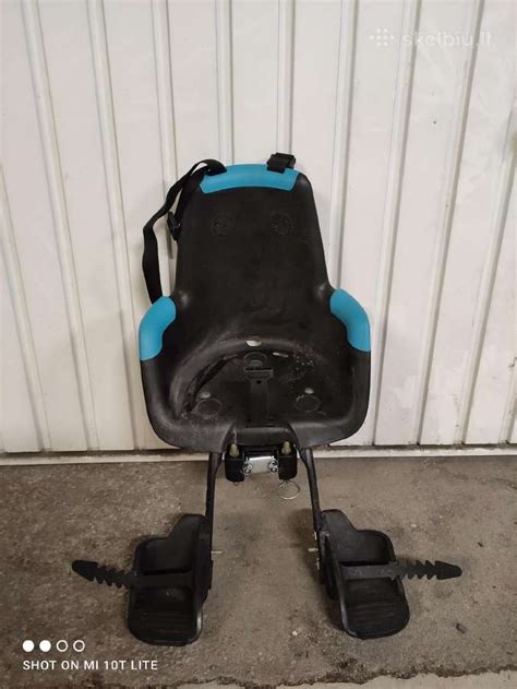 Dviračio kėdutė vaikui tvirtinama priekyje